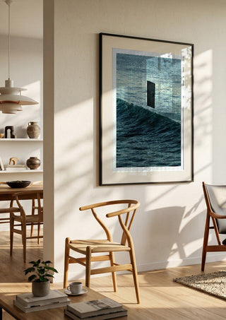 Deep Blue by Fran Rodriguez in a black frame in a bright dining room with wooden chairs