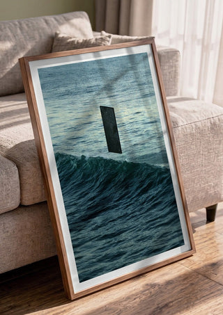 Deep Blue by Fran Rodriguez in a walnut frame leaning against a grey sofa