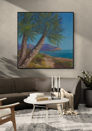 View from Isla Plana to La Azohía, Cartagena, Spain by PaKart in a black frame above a grey sofa with a round table and candlesticks