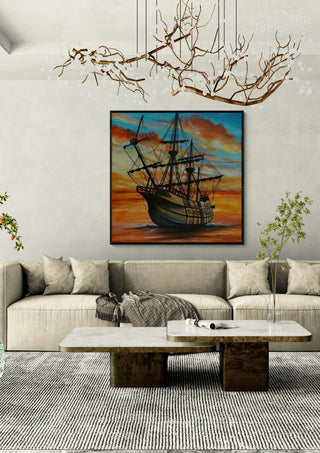 Beautiful Sailing by Sunny in a black frame above a beige sofa under a branch chandelier