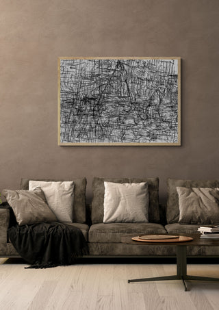 Sirius 3 by Priit Ruttas in a pale wooden frame above a grey sofa with cushions