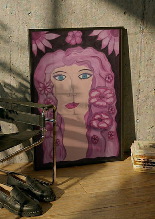 Flower Power by Carmen Coduri in a black frame leaning against a concrete wall by a steel chair