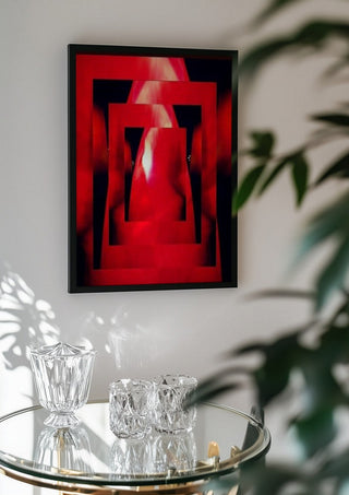 Corazon by Carlos Enrique Gozalo Ara in a black frame above a glass table with crystal glassware