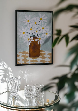 Rutig duk med brun vas by Rebecka Hansson in a black frame above a glass table with crystal glassware