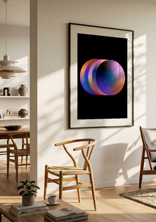 Layers by Aleksi Allan in a black frame in a bright dining room with wooden chairs