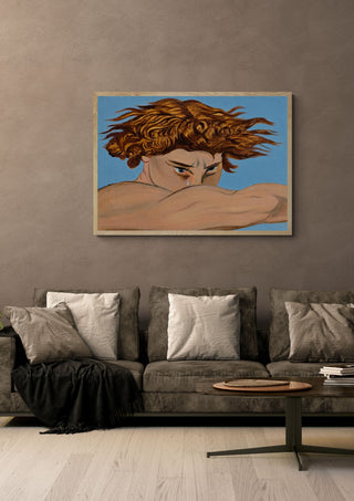 Lucifer (my view) by Zhan Snow in a pale wooden frame above a grey sofa with cushions