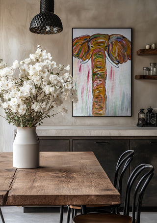 Chromatic Matriarch by Bibi in a black frame above a rustic table with white flowers