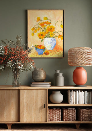 Poppies And Peaches by Deblina Dey above a wooden sideboard on a sage green wall