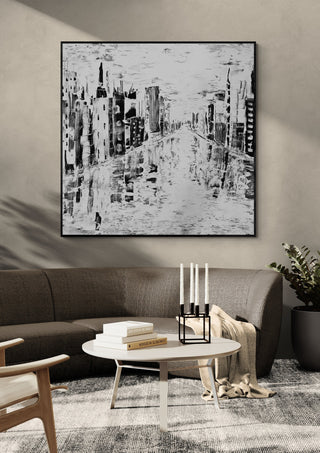 Beyond Time by Sabine Halbrock in a black frame above a grey sofa with candlesticks
