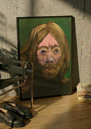 Lennon by Ian Frederick Harris in a black frame leaning against a concrete wall by a steel chair