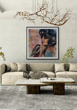 Sound of Hope by Elisa Kay framed above a long sofa under a branch chandelier