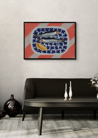Fishys on plate by Astrid Lind in a black frame above a dark sofa with white candlesticks