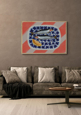 Fishys on plate by Astrid Lind in an oak frame above a grey sofa with cushions