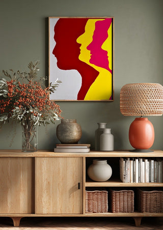 Genesis by Tonia above a wooden sideboard on a sage green wall