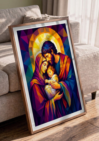 The Holy Family in Divine Light by nyai in a walnut frame leaning against a grey sofa