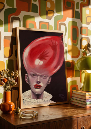 Thin Air by Ronny Simon in a wooden frame on a sideboard against retro patterned wallpaper