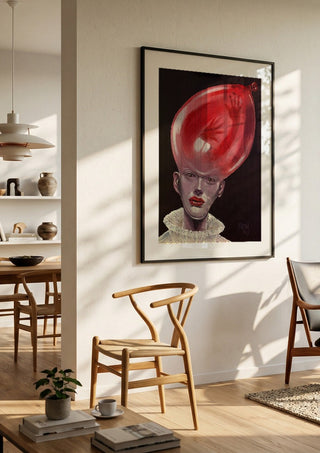 Thin Air by Ronny Simon in a black frame in a bright dining room with wooden chairs