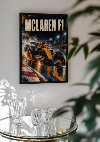 McLaren F1 by Danii Steinfeldt in a black frame above a glass table with crystal glassware