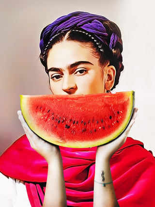 Woman holding a watermelon slice over her mouth, wearing a purple headscarf and red shawl.