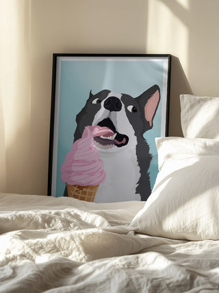 Framed artwork of a happy dog licking pink ice cream, displayed on a cozy bed.