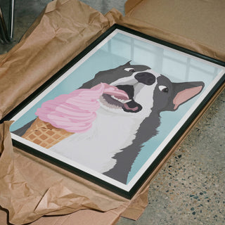 Framed artwork of a happy dog licking a pink ice cream cone, displayed for Happy Dog Ice Cream - ByKammille.