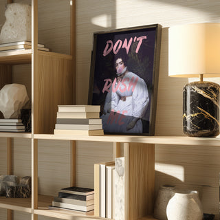 Framed Sassy Lady Pink Bubble print by Talitha McQueen on a wooden shelf with books and decorative items.