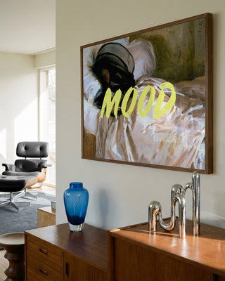 Framed "Woman In Repose - Talitha McQueen" artwork with bold yellow "MOOD" text, displayed above a sideboard.