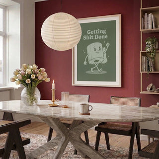 Framed "Getting Things Done Roll" poster by Andreas Magnusson displayed in a modern dining room.