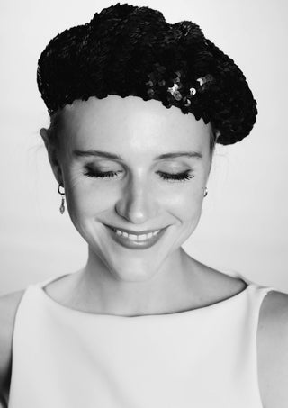 The French girl by Bettinafloorphoto - a smiling young woman in a black sequinned beret