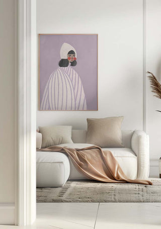 Framed print of "The Woman With the White Hat" by Bea Muller hanging above a white sofa in a modern living room.