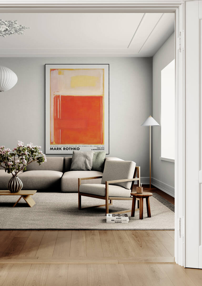 Framed Rothko Orange Perspective art print hanging above a beige sofa in a modern living room.
