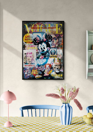 Framed Minnie - Ricardo Noble art print with a colorful collage, displayed above a dining table with flowers.