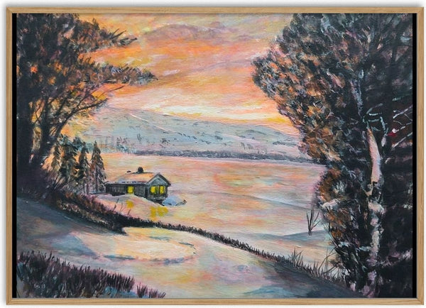 A Winter Retreat by Finbar Stevens - a lit cabin in the snow by a frozen lake at sunset