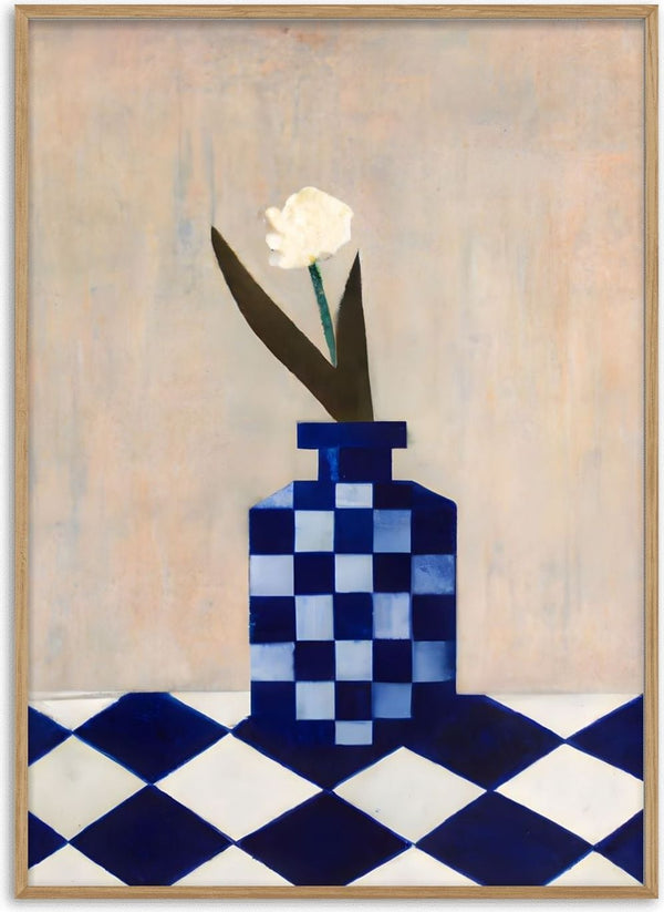 Check the vase by Interiorisla - a white carnation in a navy checked vase on a tiled floor