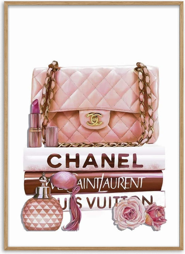 A pink Chanel bag, lipstick, and perfume on fashion books with roses.