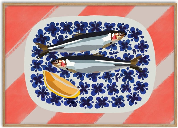 Fishys on plate by Astrid Lind - two fish and a lemon wedge on a blue flowered plate