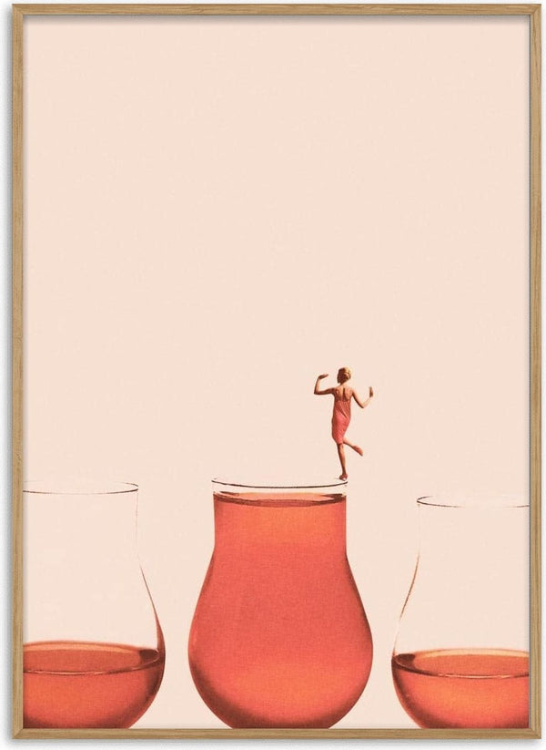 A woman in a red dress stands confidently atop a full glass of pink liquid, flanked by two half-full glasses.