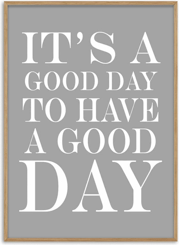 Poster with the quote "It's a good day to have a good day" in bold white text on a gray background.
