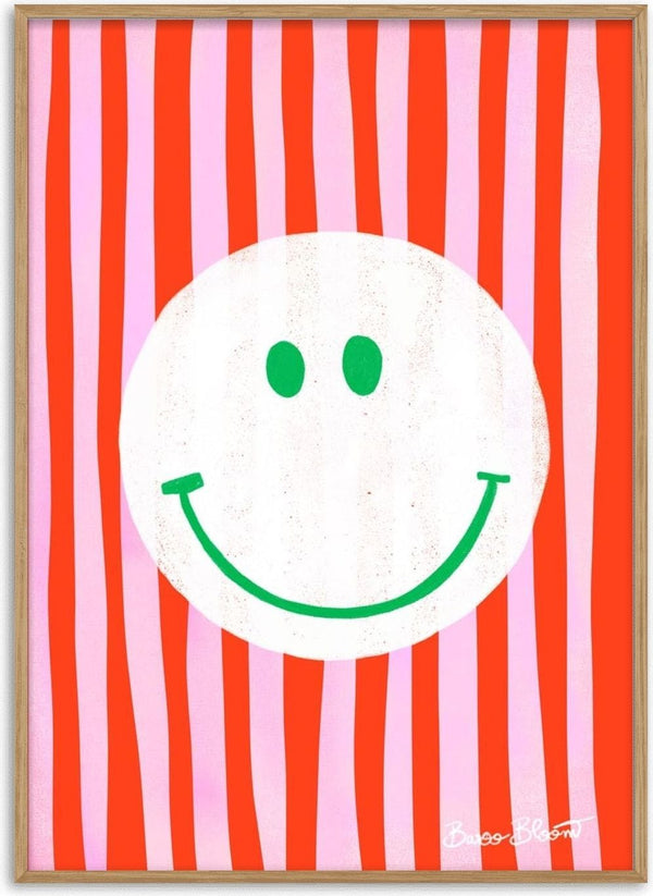 Pink Smiley In Stripes by Baroo Bloom: White smiley face with green features on pink and red striped background.