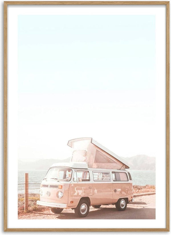 A pink vintage van with a pop-up roof parked by the sea, featured on the Pink Van at the Sea Plakat product page.