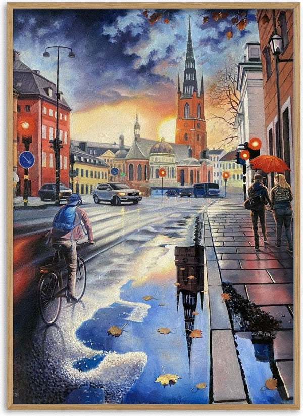 Stockholms promenad by Ramz Gadzh - a cyclist on a wet Stockholm street with a church spire mirrored in a puddle
