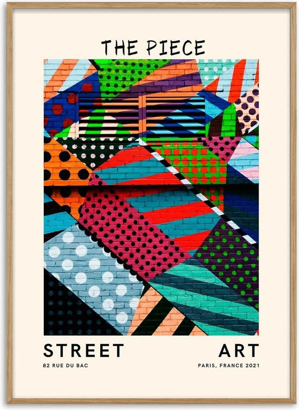 Colorful geometric street art mural with dots and stripes, titled "The Piece Plakat" on a product display.